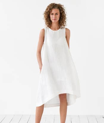 model wearing the white linen dress