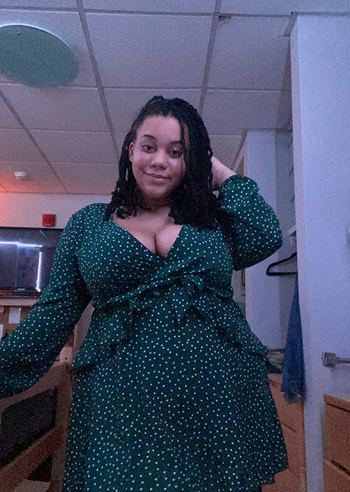 reviewer wearing the green with white polka dots version