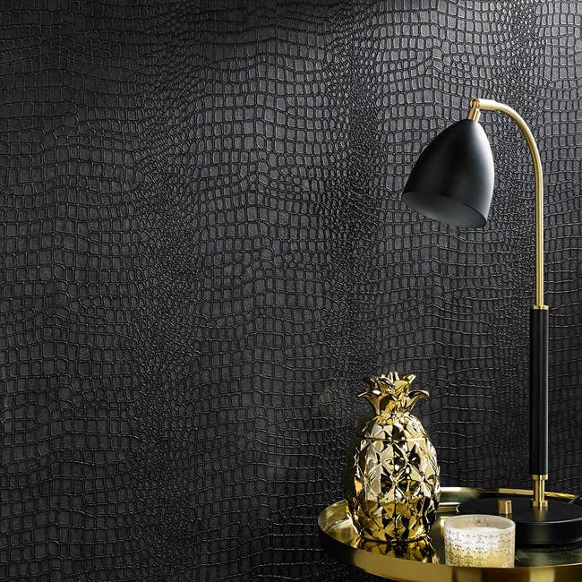 wall with black faux crocodile temporary wallpaper on it