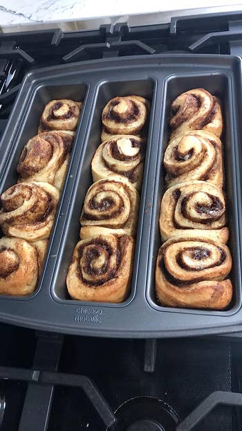 The pan filled with cinnamon buns