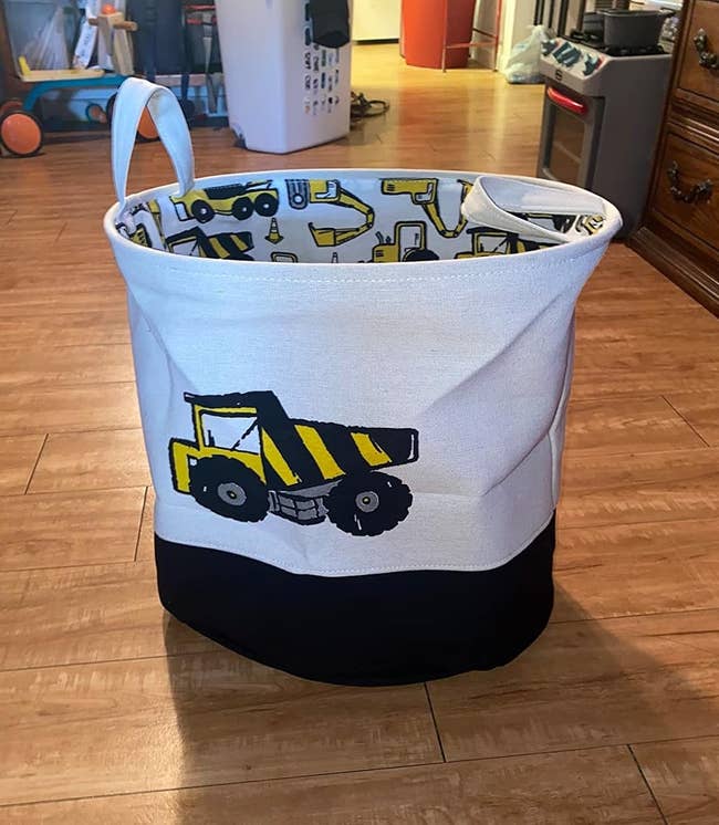 reviewer image of the organizer bin with a truck printed on it