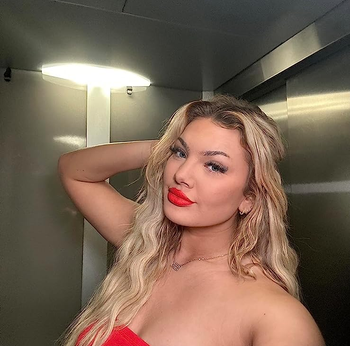 reviewer selfie wearing bright red lip stain