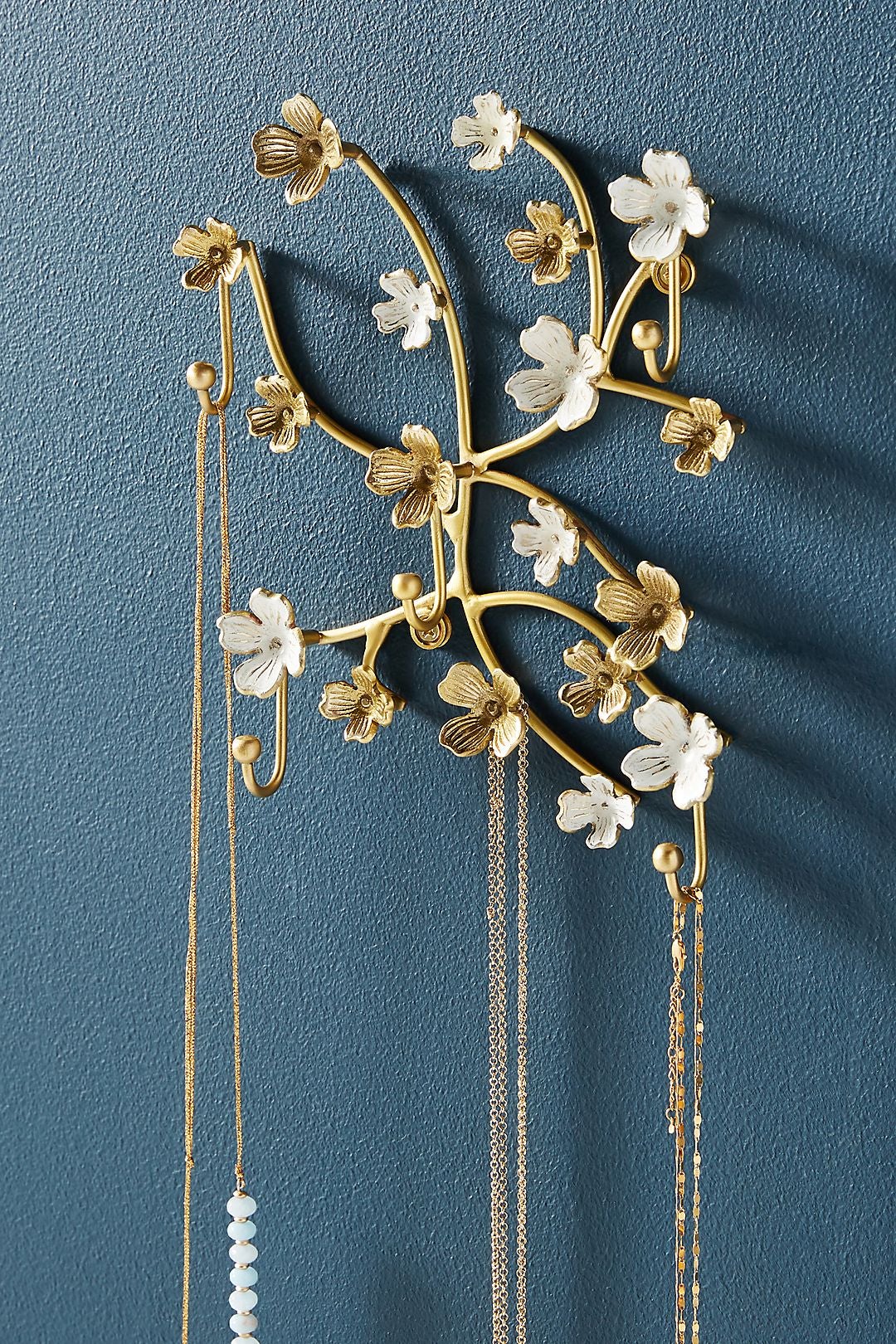 floral jewelry tree mounted onto wall