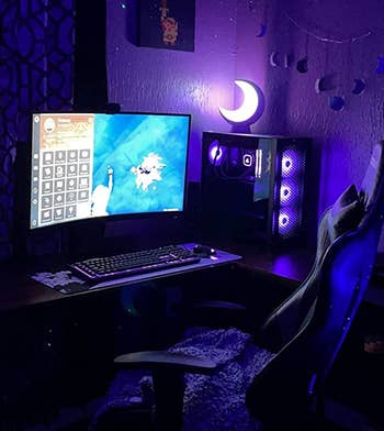 the glowing moon lamp in a reviewer's darkened setup