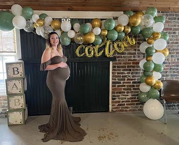 reviewer posing in olive green maxi dress