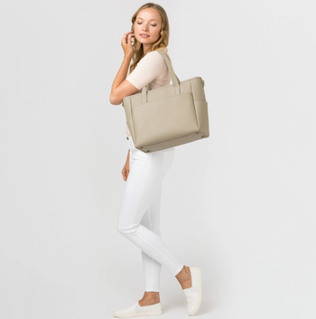model using the stone colored tote 