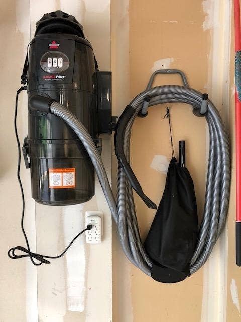 the shop vac mounted on the wall