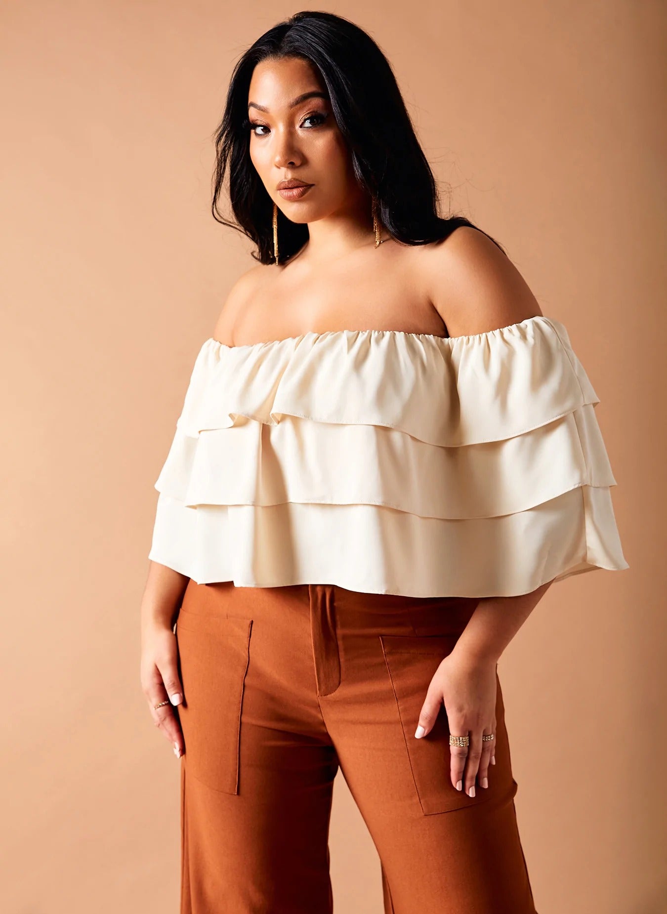 model wearing the off-the-shoulder ruffle top in ivory