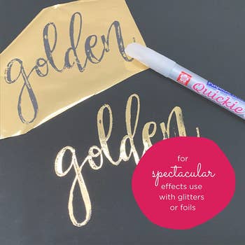 The pen being used for gold foiling the word 