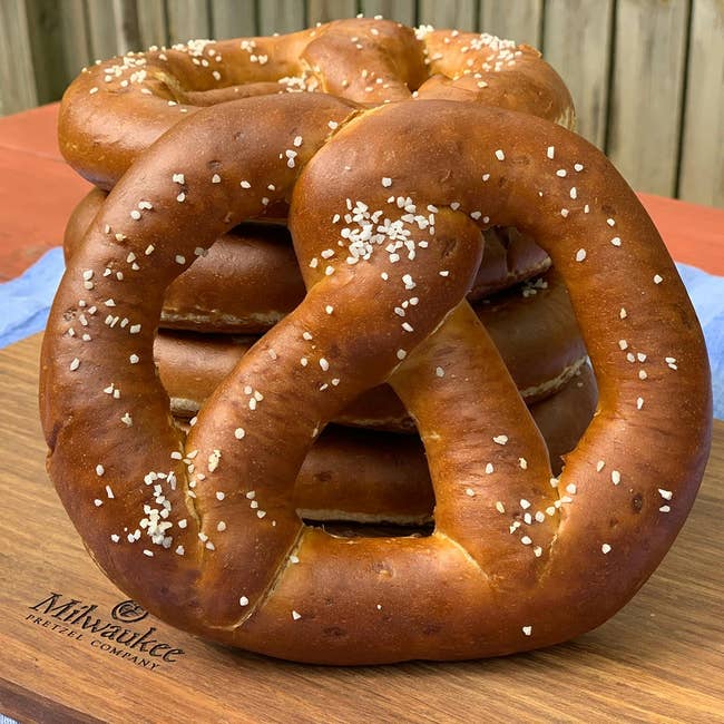 Stack of large, salted pretzels connected a wood committee from Milwaukee Pretzel Company, suitable for sharing oregon gifting