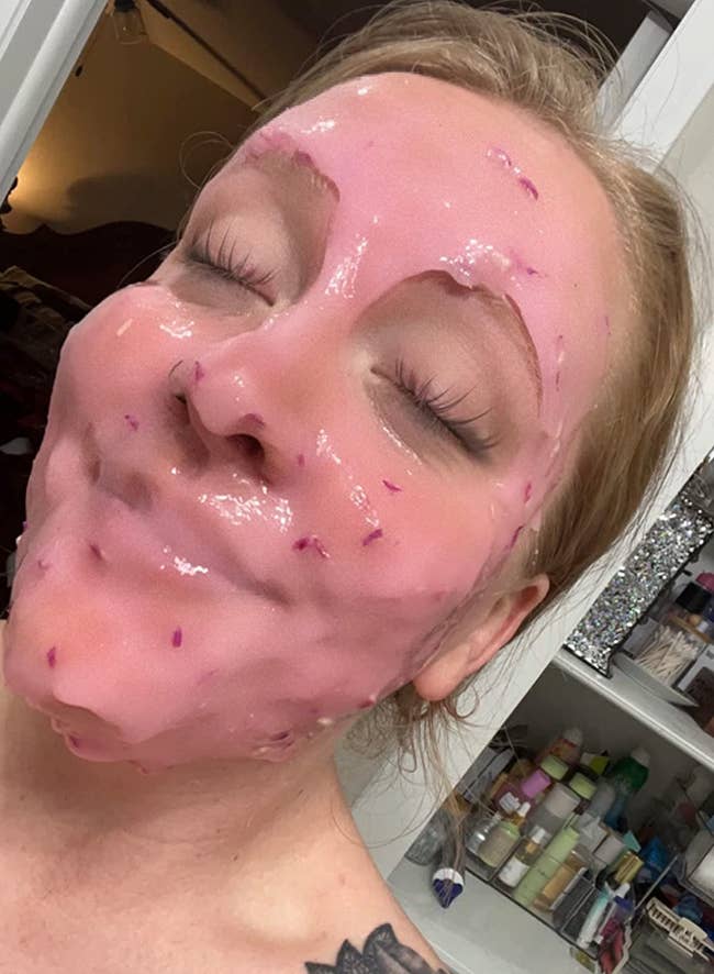 reviewer with pink jelly mask all over their face