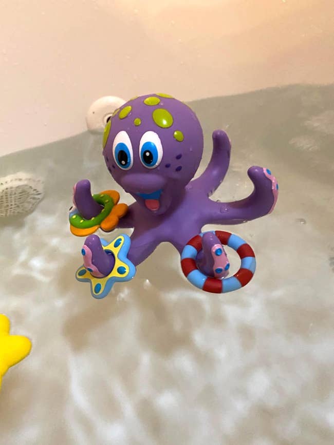 a purple rubbery octopus bath toy