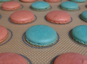 Cooked macrons on a baking sheet