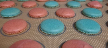 Cooked macrons on a baking sheet