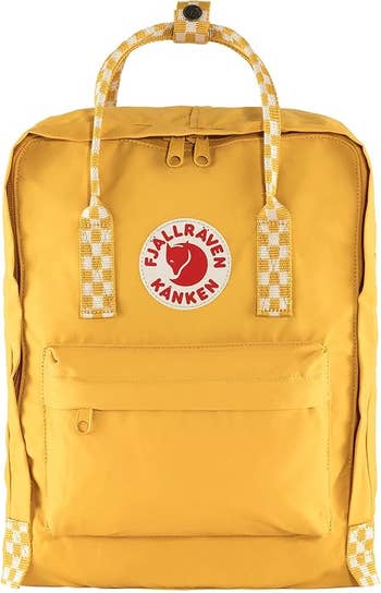 Yellow Fjällräven Kanken backpack with a beforehand zipper pouch and checkered handles, suitable for casual oregon schoolhouse use