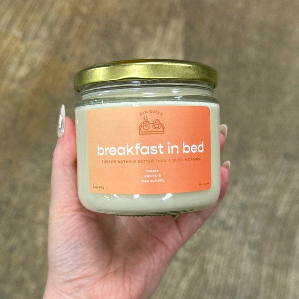 Hand holding a jar of 