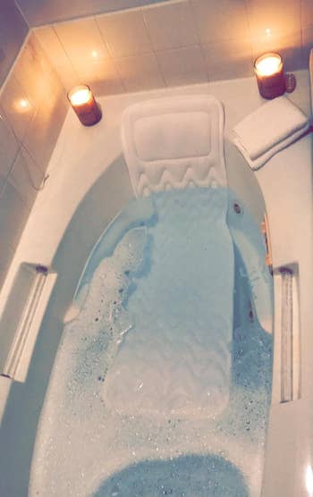 a reviewer photo of the bath in a filled up tub 