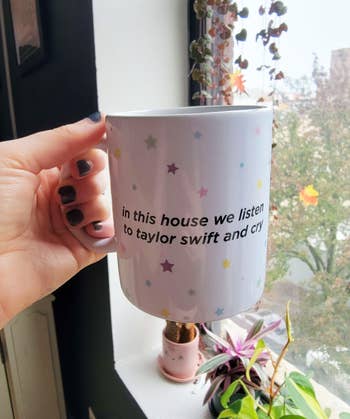the white mug with colorful stars that says 