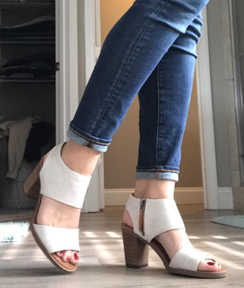 side view of reviewer wearing the white sandals