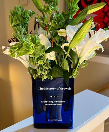 another reviewer's blue book vase filled with flowers