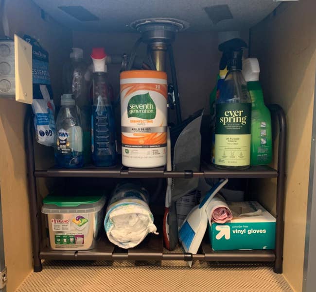 reviewer photo of products on adjustable rack under a sink