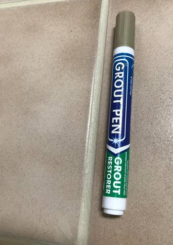 a reviewer photo of the grout pen next to tile grout after the pen has been applied 