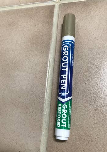 a reviewer photo of the grout pen next to tile grout after the pen has been applied 