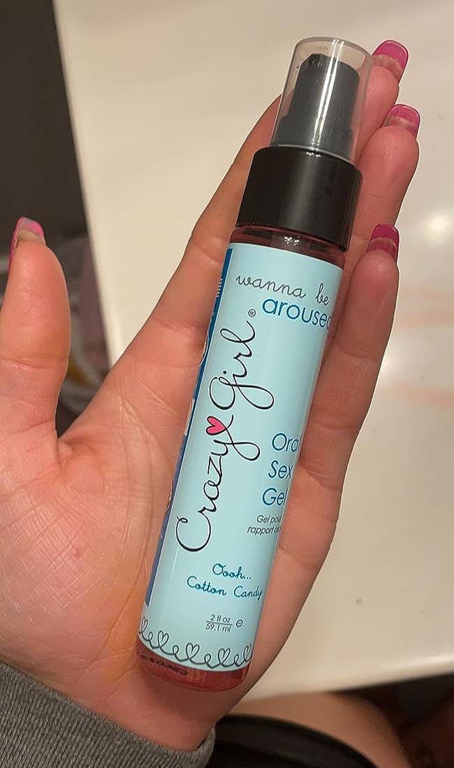 reviewer holding crazy girl oral sex gel cotton candy flavor