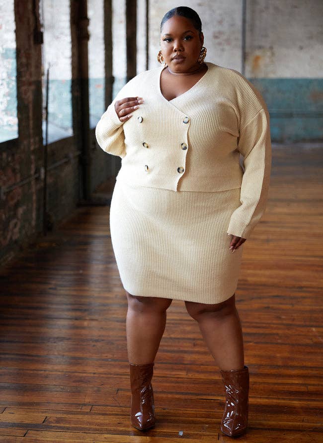 a model posing in the beige outfit