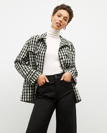 Model wearing the black-and-white gingham jacket