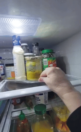 reviewer spinning the turn table in their fridge