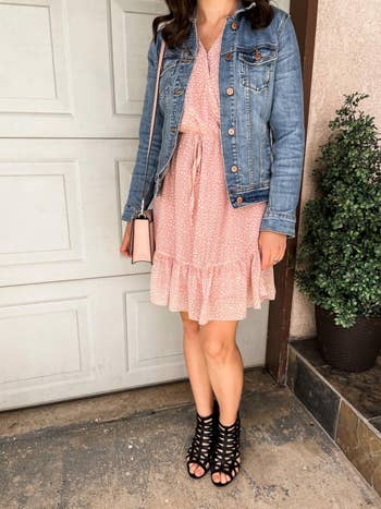 reviewer wearing pink dress with denim jacket over