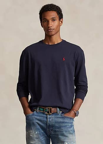 model posing wearing long-sleeve shirt in blue