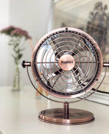 mini copper fan on reviewer's dresser