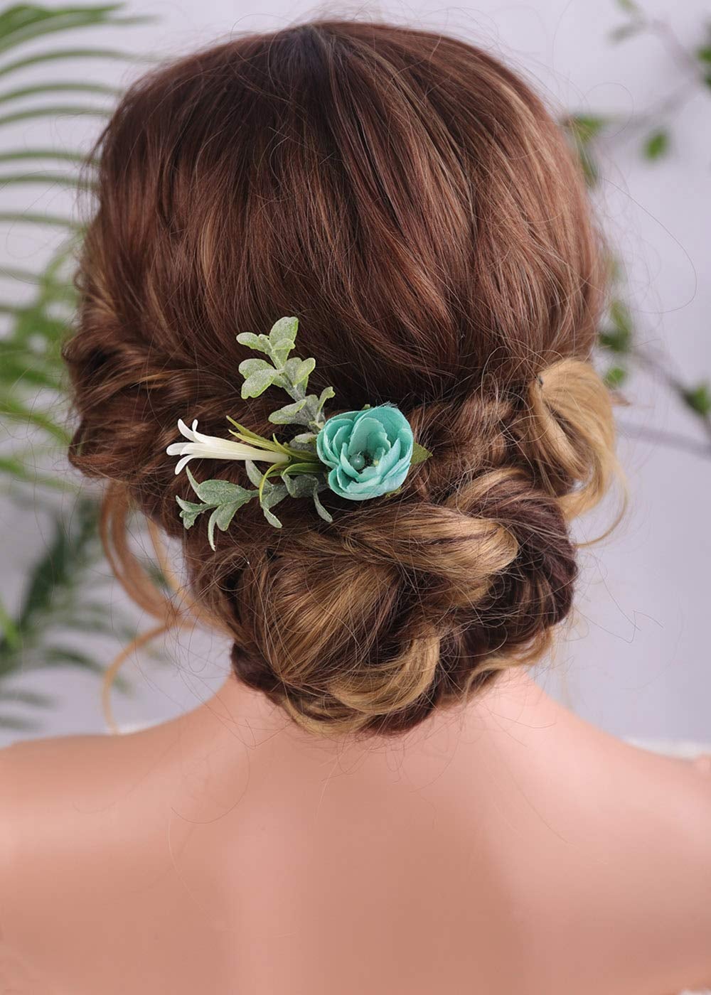 hair clip made to look like eucalyptus, honeysuckle, and a blue rose 