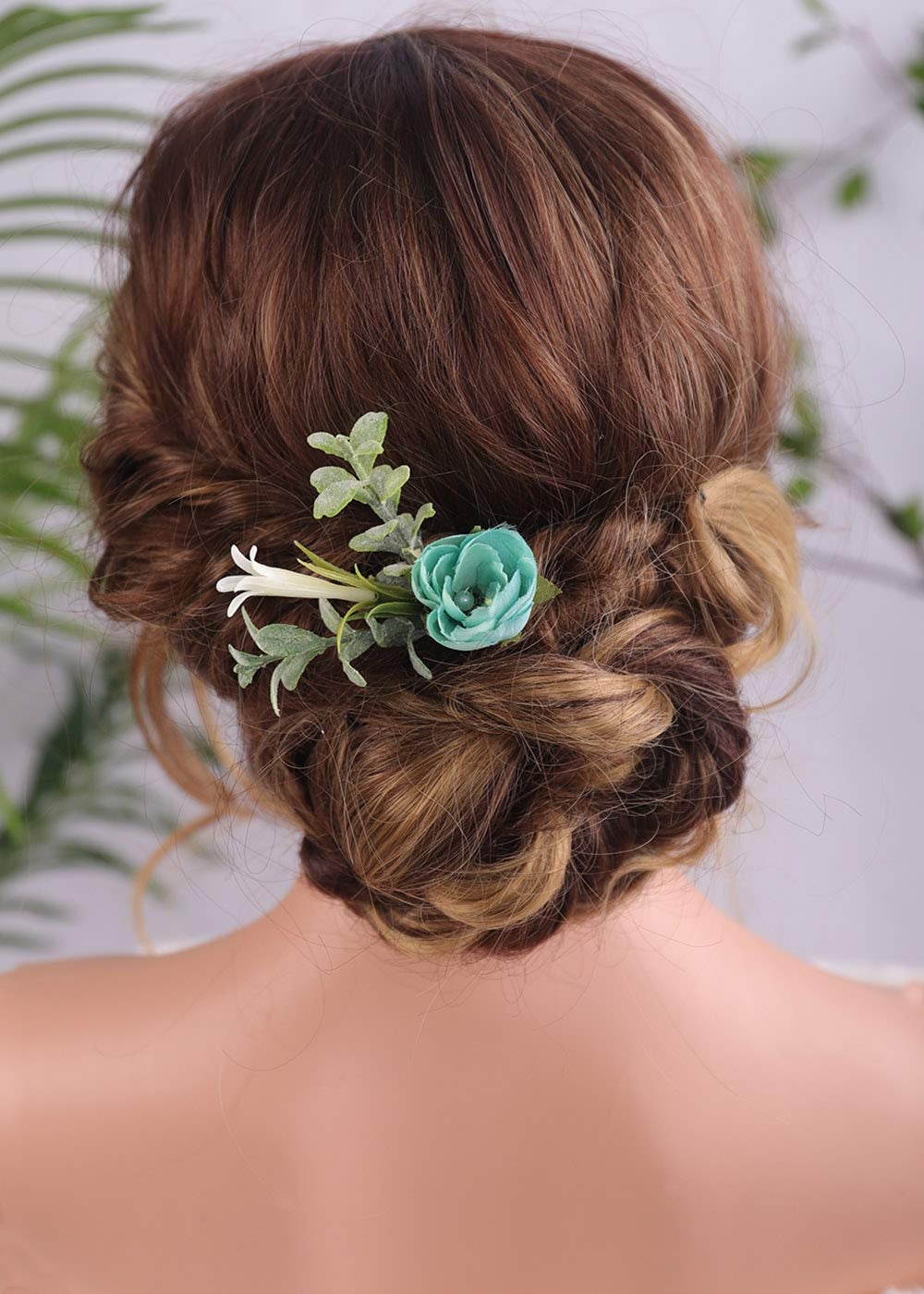 hair clip made to look like eucalyptus, honeysuckle, and a blue rose