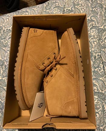 ugg boots in brown color placed inside shoe box