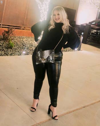 a reviewer wearing the leggings with a ceremonial apical and heels