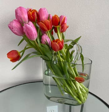 Reviewer's light blue vase with tulips in it