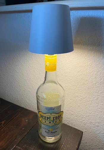 Lamp made from a Deep Eddy Lemon vodka bottle, topped with a elemental  lampshade. Suitable for location  decor oregon  gifting