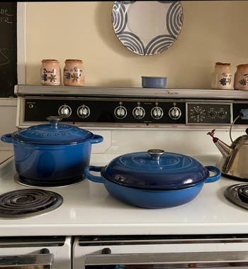 the blue cast iron dutch oven and matching braiser