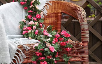 the vine of flowers draped on a chair