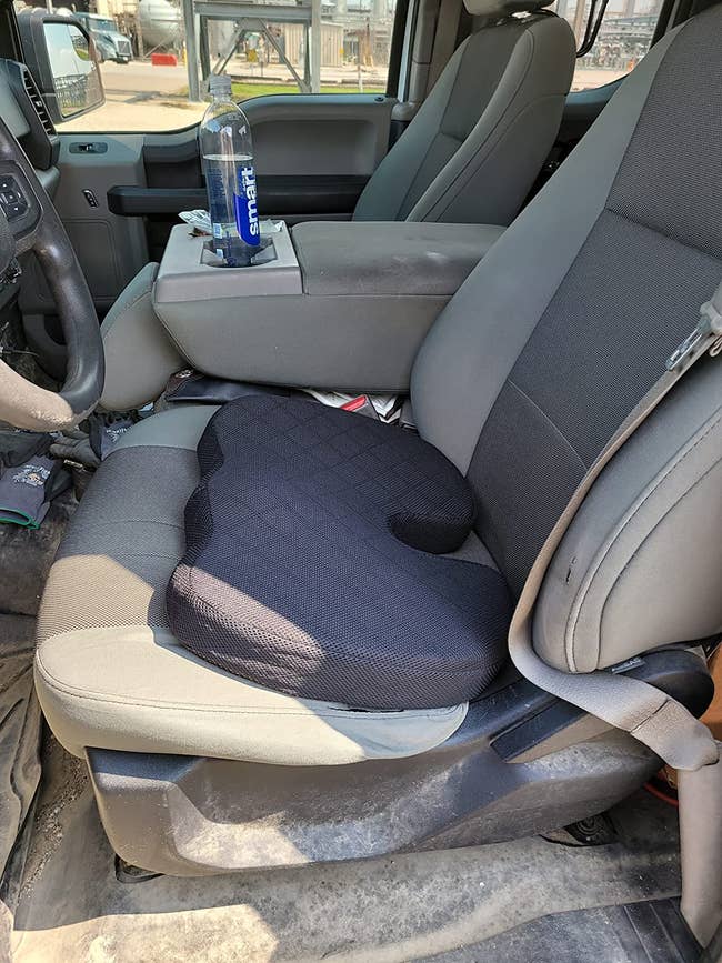 reviewer's cushion on a car's driver seat