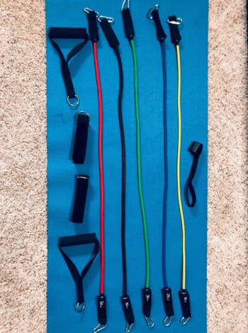 resistant band kit laid out on a yoga mat