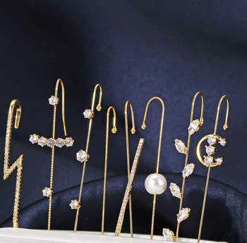 the set of eight gold earrings
