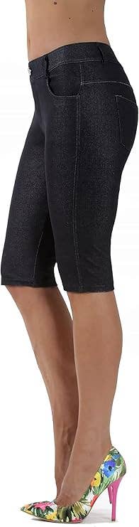 Person wearing knee-length denim shorts and multicolored floral high heels, shown from the side