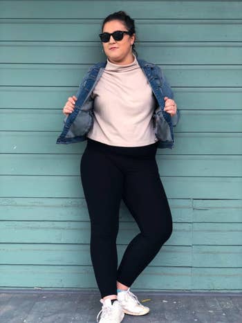 reviewer wearing the dark denim jacket