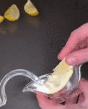 Model squeezlng a lemon into a jar 