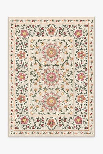 an ivory rug with an intricate floral print on it