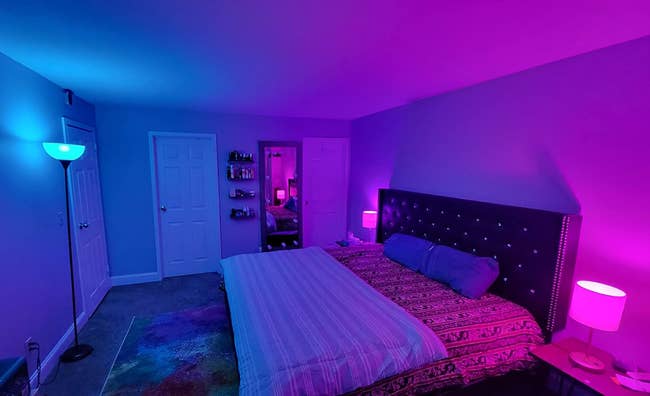 bedroom with color changing bulbs installed in the lamps